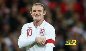 Wayne Rooney adjusts his England captain's armband