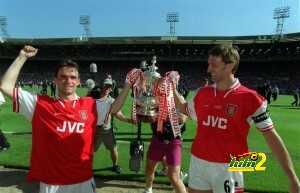 Football. 1998 FA Cup Final. Wembley. 16th May, 1998. Arsenal 2 v Newcastle United 0. Arsenal goalscorer Marc Overmars (left) and captain Tony Adams carrying the trophy after the match.