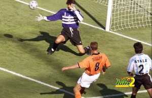 Dutch forward Dennis Bergkamp kicks the ball past