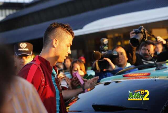 Ronaldo prepares to enter a taxi after returning from the 2014 World Cup in Brazil with the national soccer team, at Lisbon airport