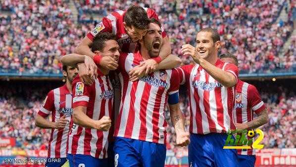 MADRID, SPAIN - APRIL 05: Raul Garcia (2ndR) of Atletico de Madrid celebrates scoring their opening goal with team-mates Koke (L), David Villa (2ndL) and Mario Suarez (R) during the La Liga match between Club Atletico de Madrid and Villarreal CF at Vicente Calderon Stadium on April 5, 2014 in Madrid, Spain. (Photo by Gonzalo Arroyo Moreno/Getty Images)