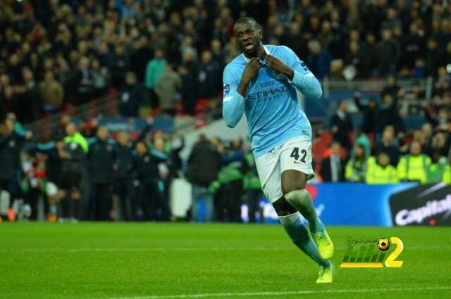 Manchester City's Ivorian midfielder and captain Yaya Toure celebrates scoring the winning penalty int he shoot-out to help Manchester City win the English League Cup final football match between Liverpool and Manchester City at Wembley Stadium in London on February 28, 2016. / AFP / GLYN KIRK / RESTRICTED TO EDITORIAL USE. No use with unauthorized audio, video, data, fixture lists, club/league logos or 'live' services. Online in-match use limited to 75 images, no video emulation. No use in betting, games or single club/league/player publications. / (Photo credit should read GLYN KIRK/AFP/Getty Images)