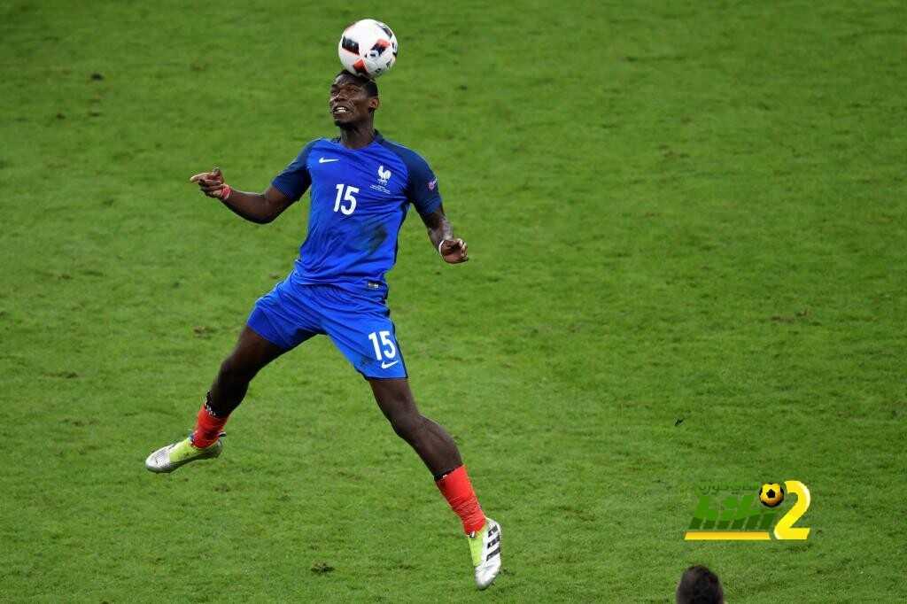 France's midfielder Paul Pogba heads the ball during the Euro 2016 final football match between Portugal and France at the Stade de France in Saint-Denis, north of Paris, on July 10, 2016. / AFP PHOTO / MIGUEL MEDINA