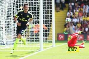 WATFORD, ENGLAND - AUGUST 27: Mesut Ozil of Arsenal scores his sides third goal during the Premier League match between Watford and Arsenal at Vicarage Road on August 27, 2016 in Watford, England. (Photo by Christopher Lee/Getty Images)