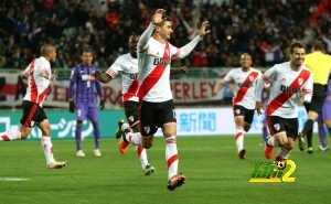 River Plates Lucas Alario, centre, gestures as he celebrates after scoring a goal against Sanfrecce Hiroshima during their semifinal match at the FIFA Club World Cup soccer tournament in Osaka, western Japan, Wednesday, Dec. 16, 2015. (AP Photo/Eugene Hoshiko)