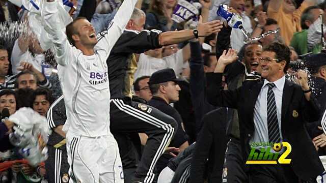 Madrid, SPAIN: Real Madrid's David Beckham (L) and Italian coach Fabio Capello celebrate with teammates after Real won the Spanish league title by beating Mallorca in the final Spanish league football match of the season, 17 June 2007 at the Santiago Bernabeu stadium in Madrid. Real won 3-1 to win their 30th league title. AFP PHOTO/ Bru GARCIA (Photo credit should read BRU GARCIA/AFP/Getty Images)